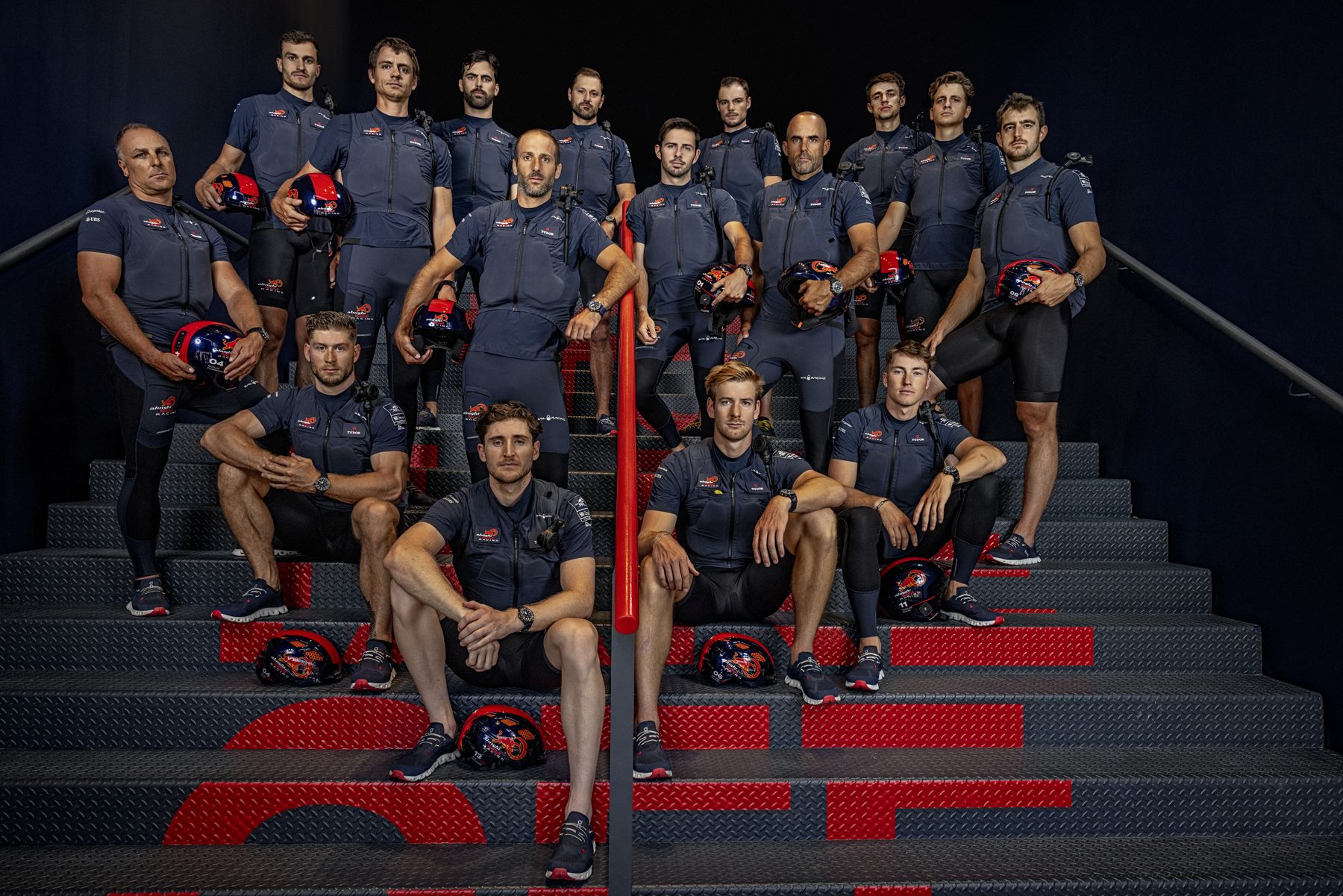 The Alinghi Red Bull Racing sailing team posed on stairs