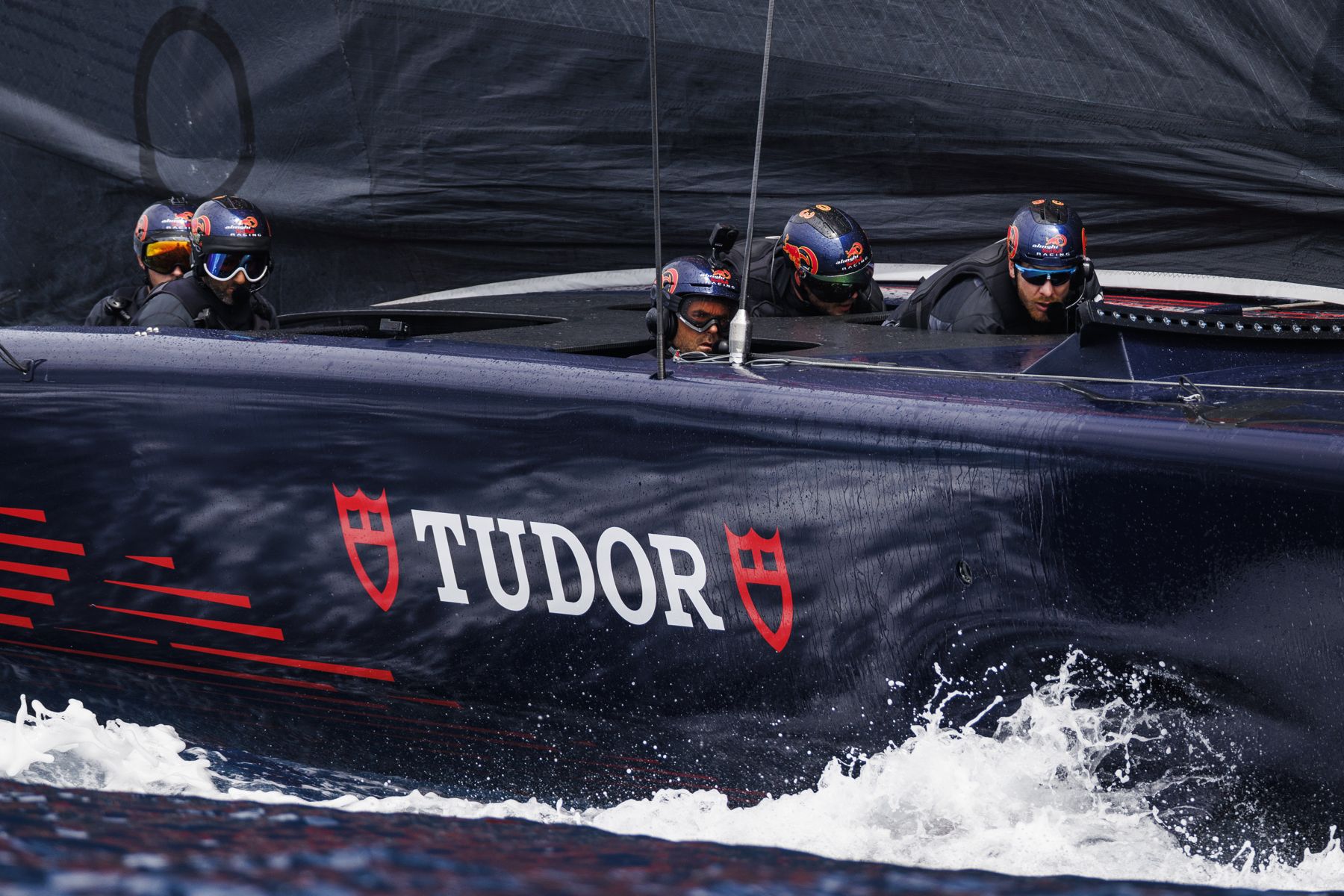 The crew aboard the boat at speed